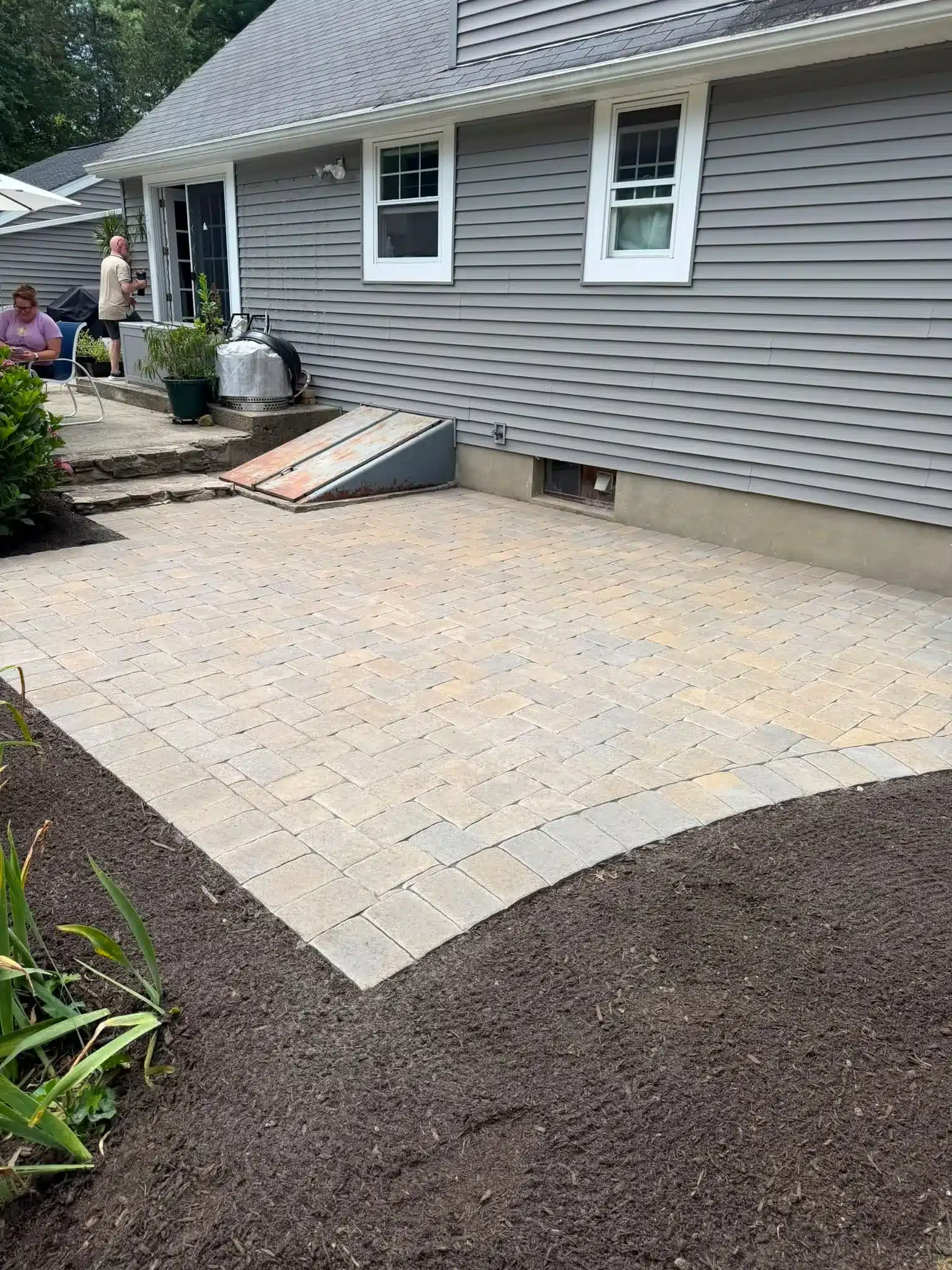Ideal Block Yankee Cobble herringbone hardscaping installation in Groton, CT by Spicer’s Lawn Care & Landscape Design.